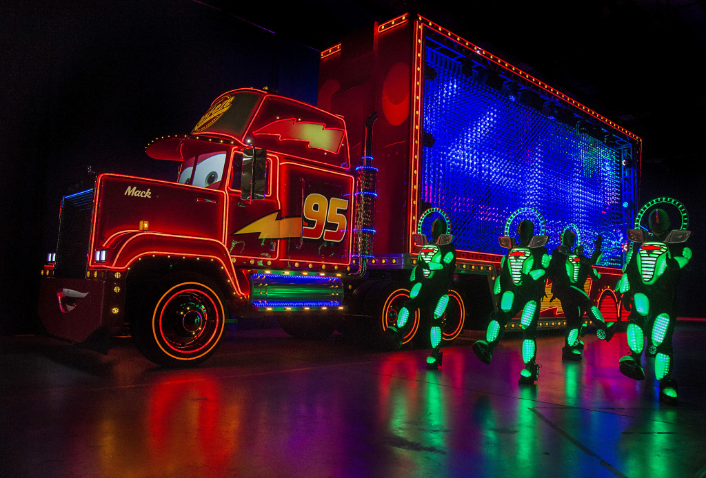 MACK AND THE CARS CREW PREVIEW "PAINT THE NIGHT" (April 14, 2015) — Mack from the Disney●Pixar 'Cars' films, one of the characters featured in the all-new after-dark spectacular, "Paint the Night," appears with parade performers in synchronized, LED costumes during a backstage media preview at Disneyland park. Inspired by the "Main Street Electrical Parade," "Paint the Night" is full of vibrant color and more than 1.5 million, brilliant LED lights and features special effects, unforgettable music, and energetic performances that bring beloved Disney and Disney●Pixar stories to life. Celebrating 60 years of magic, "Paint the Night" is one of three new nighttime spectaculars which will immerse guests in the worlds of Disney stories like never before. The Diamond Celebration at the Disneyland Resort begins Friday, May 22, 2015. #Disneyland60