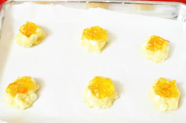 Orange Marmalade Thumbprint Cookies- Delicious white chocolate chip cookie with a spoonful of Orange Marmalade.