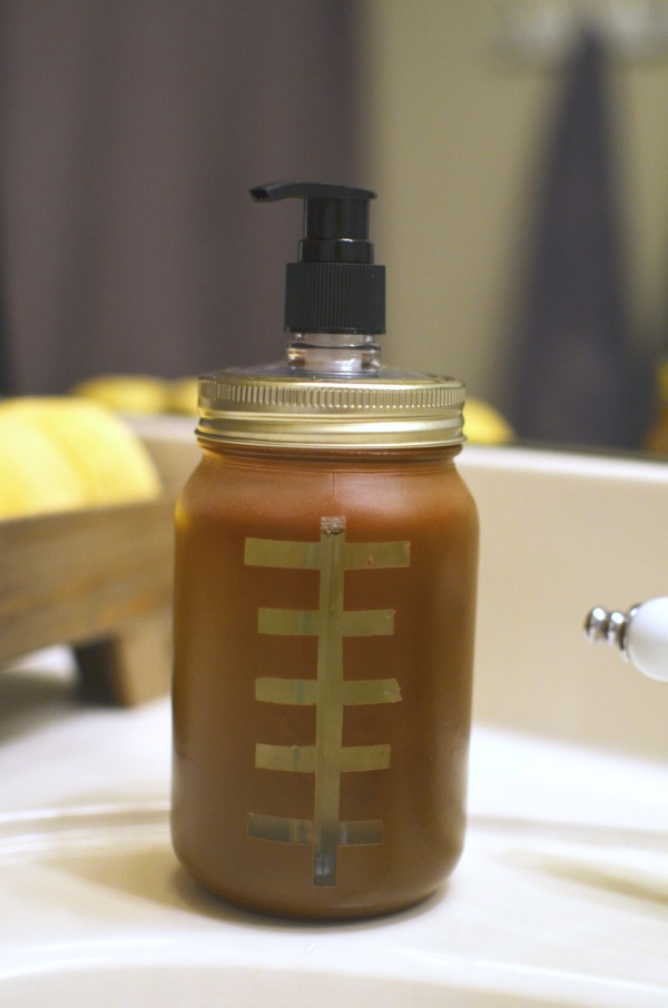 Make a touchdown with this DIY frosted mason jar soap dispenser, it looks just like a football. Plus a game day worthy guest bathroom refresh.